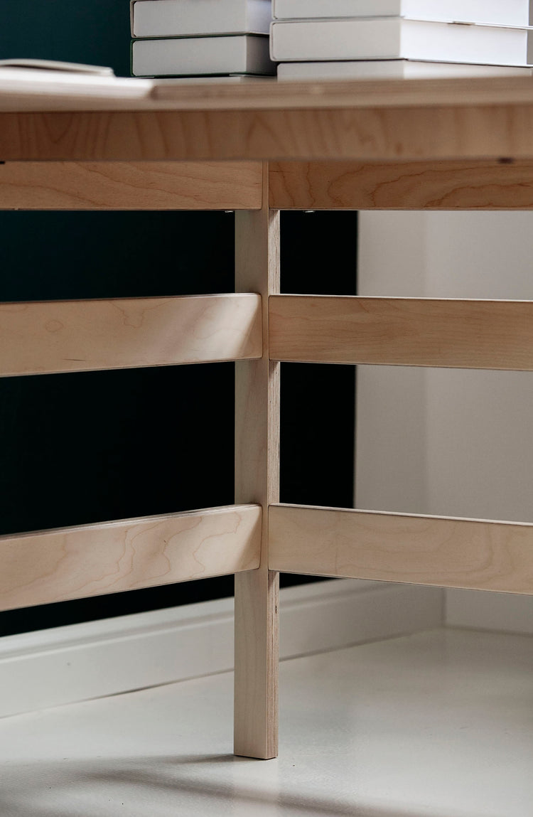 Detail-of-Mid-century-modern-corner-desk-with-drawers-and-shelves-in-natural-wood-stain