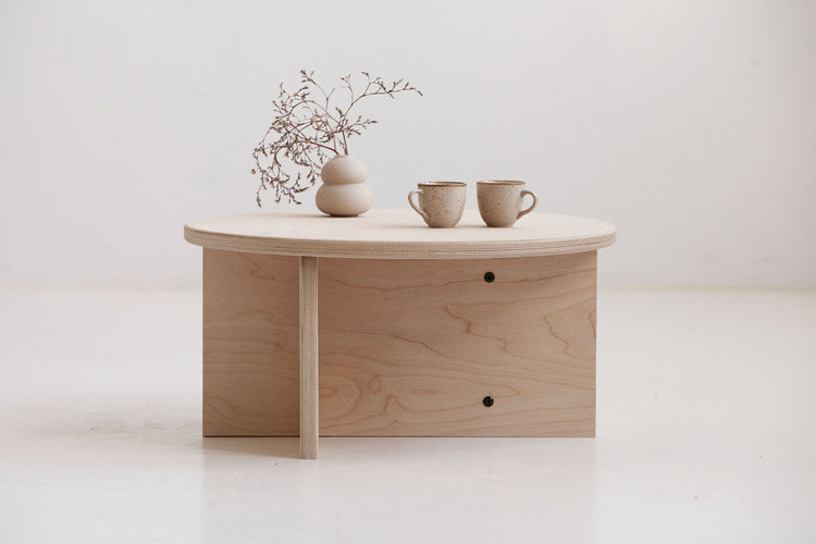 Minimalist Japandi coffee table Europe with round plywood top and lower shelf for books