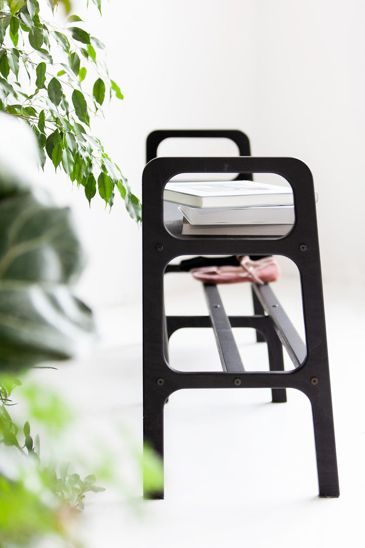 mid-century-modern-wooden-bench-in-light-background-side-view