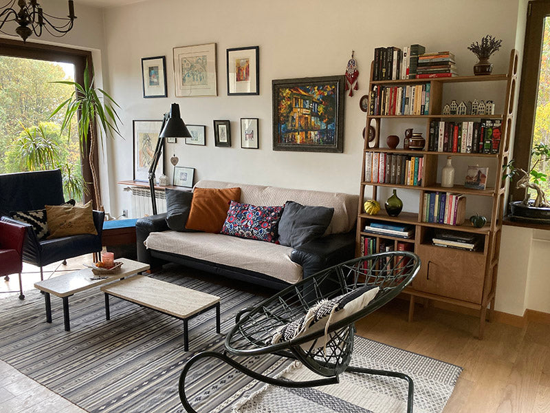 Real interior with mid-century plywood bookcase in cozy living room