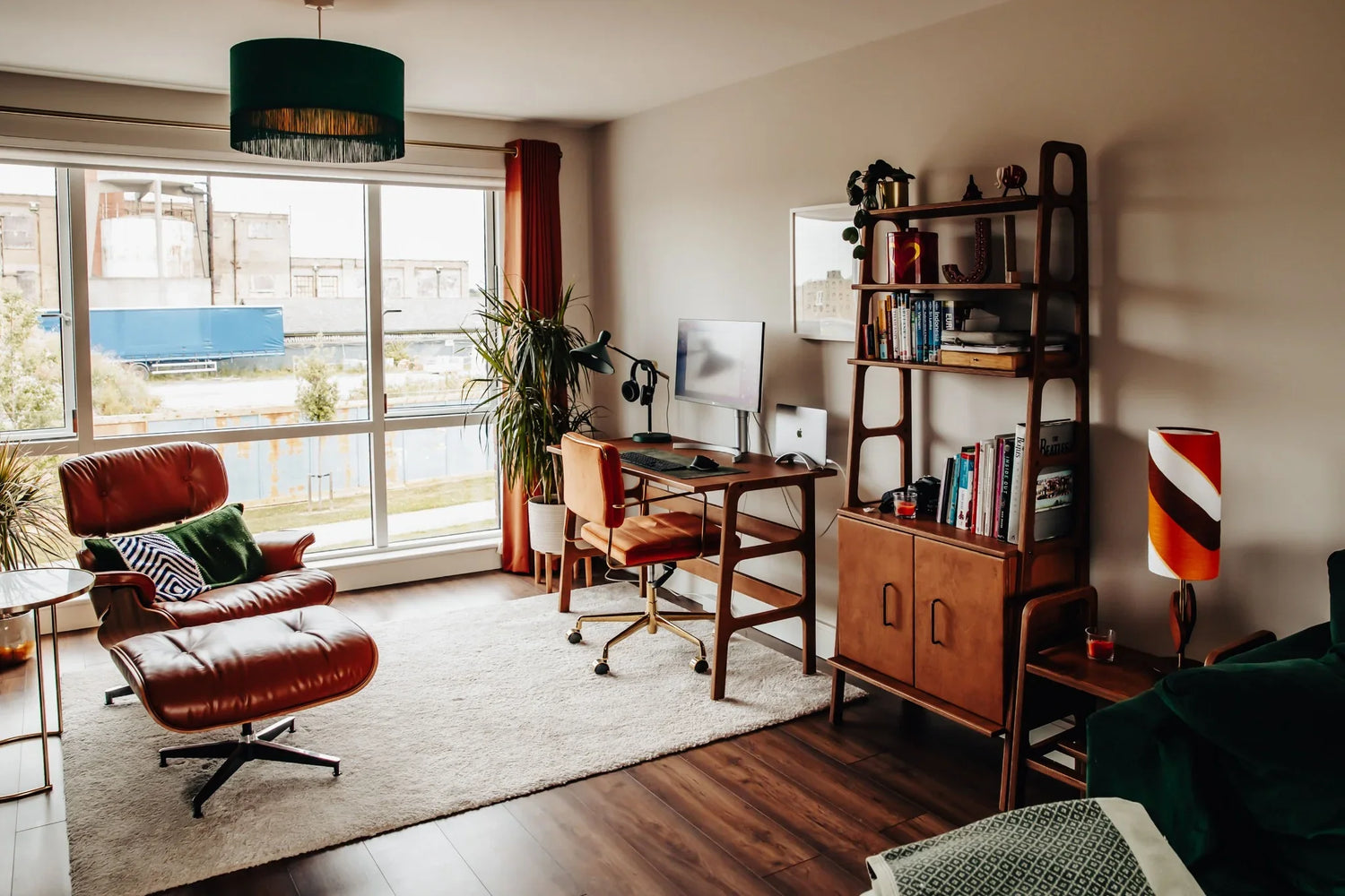 Plywood desk with matching shelving unit in vintage mid-century apartment