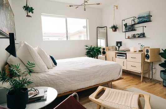 Wide view of Sideboard 460 VII in a bright Santa Monica bedroom with audio setup and plants