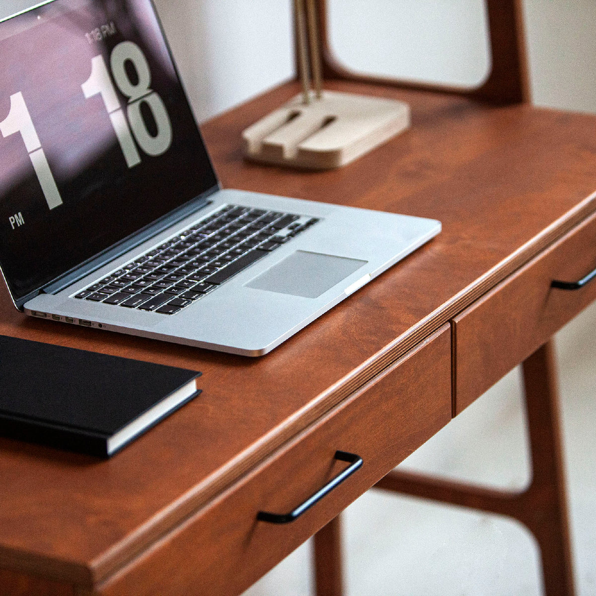 close-up-at-wooden-mid-century-modern-desk