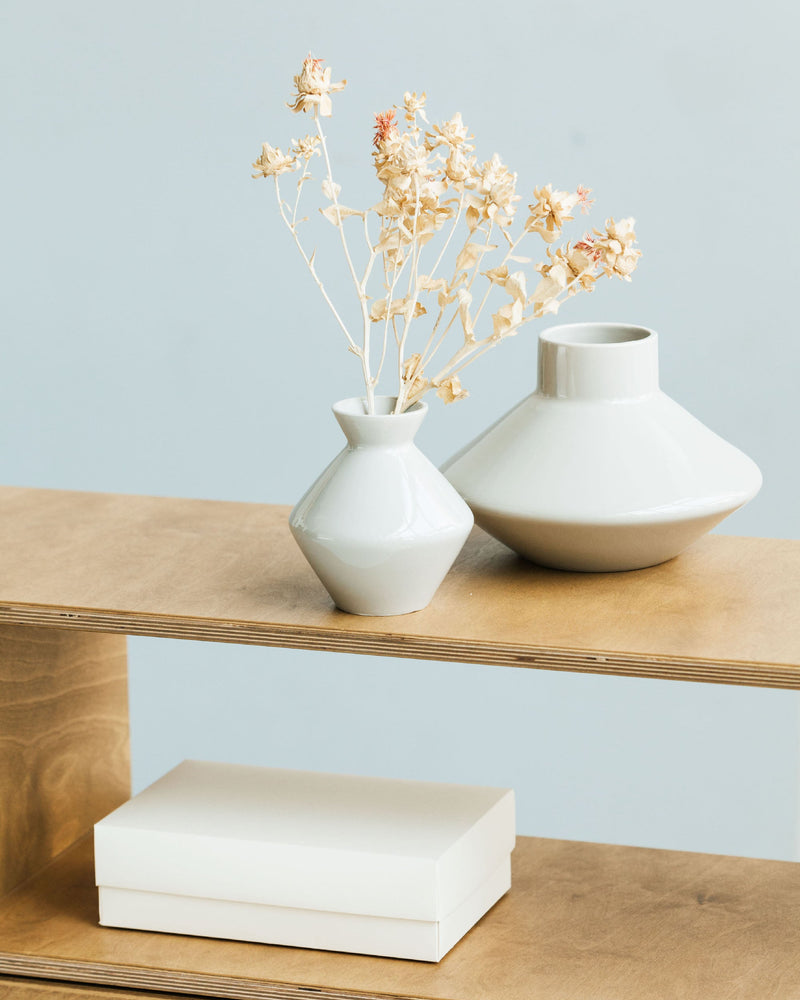 closeup-on-details-vase-on-wooden-mid-century-modern-bookcase