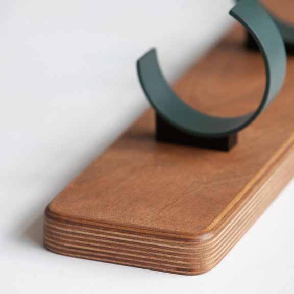 Wall coat rack in birch plywood with metal round hooks (close-up)