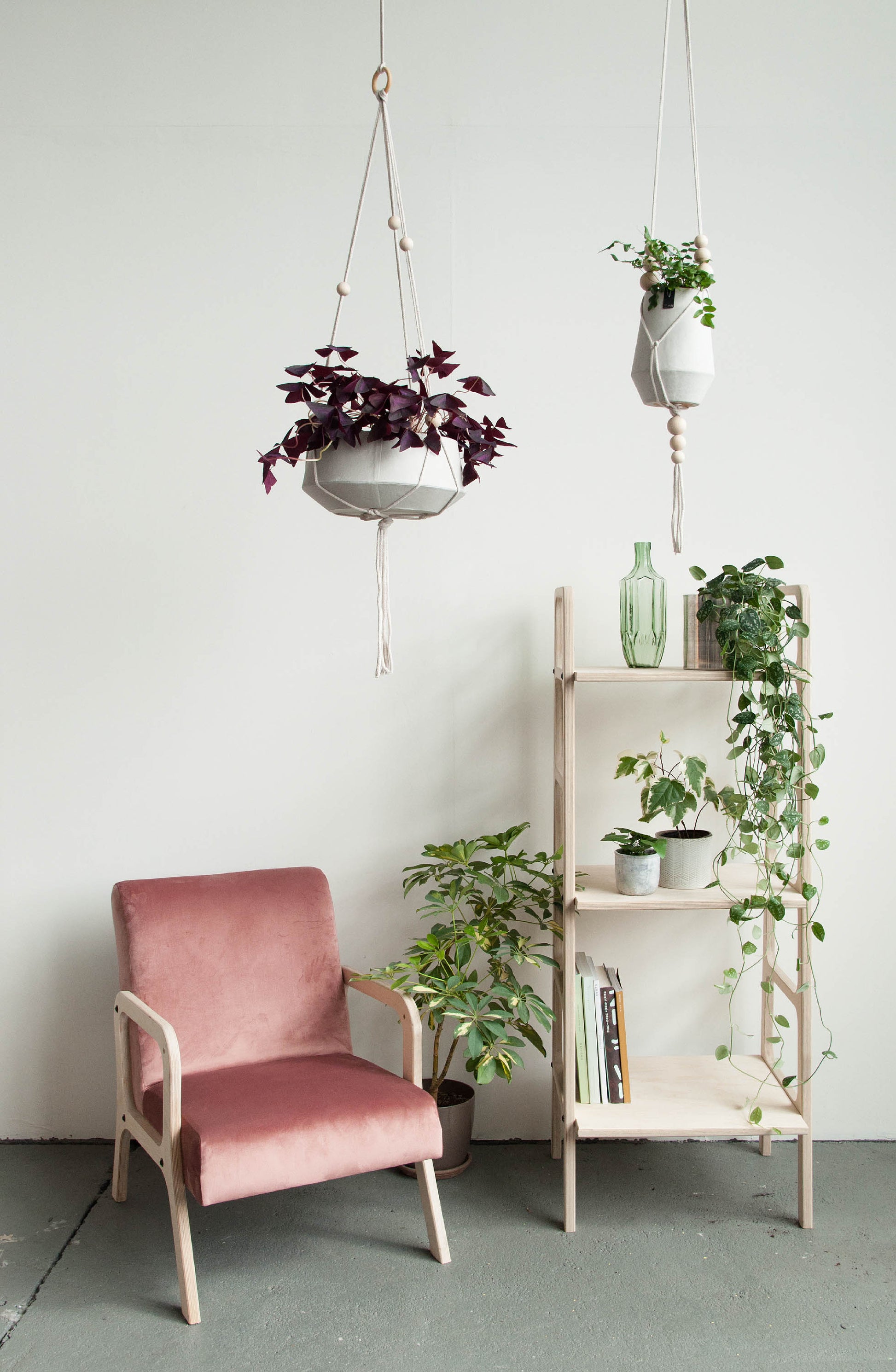 ladder-bookshelf-in-the-interior-with-armchair