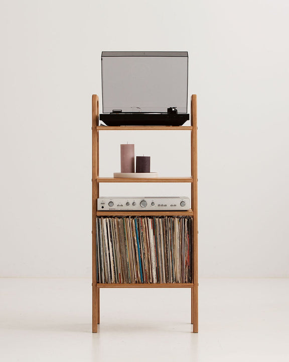 Three-quarter view of the mid-century record player stand showing turntable, display shelf, amplifier shelf and LP storage bay, wooden bookshelf