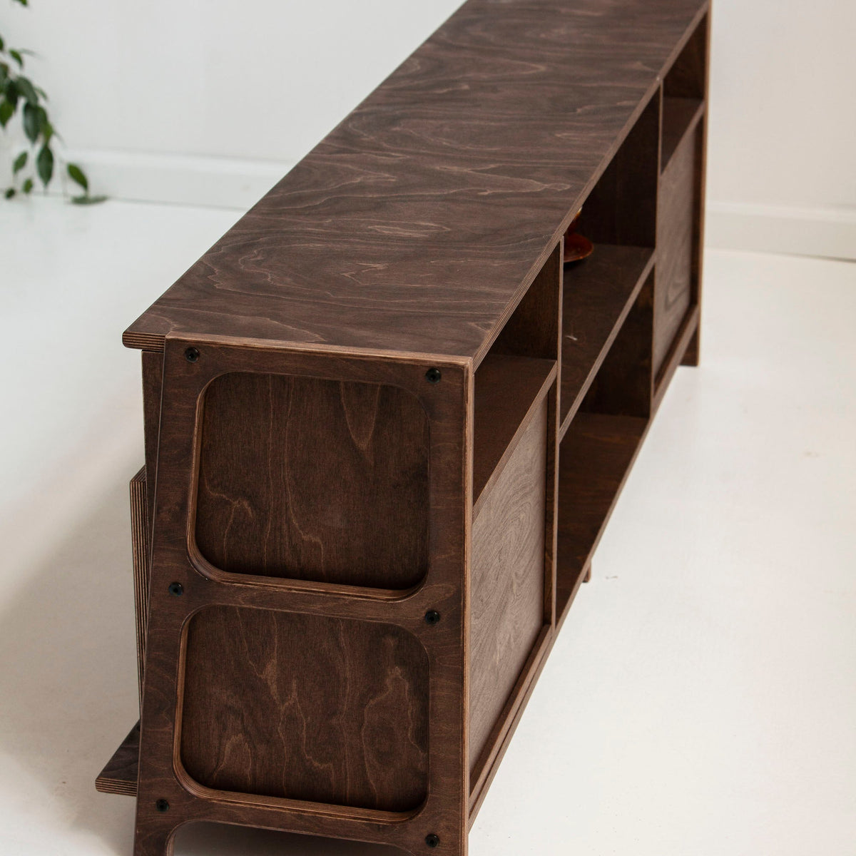 Rear and side view of mid-century TV stand showing solid wooden construction