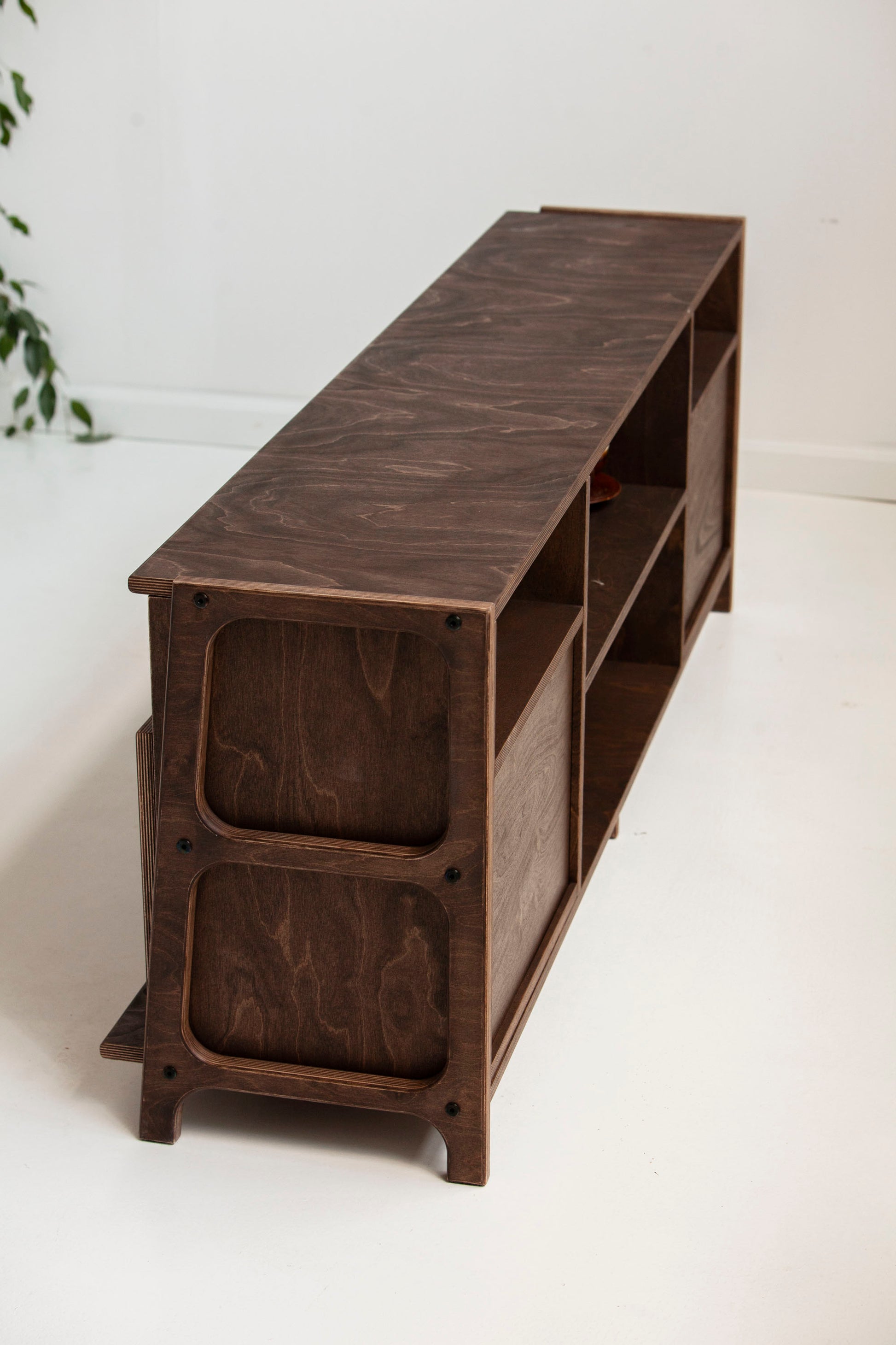 Rear and side view of mid-century TV stand showing solid wooden construction