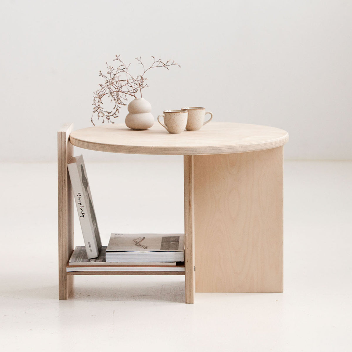 Round coffee table Europe available in walnut, teak, and natural birch finishes