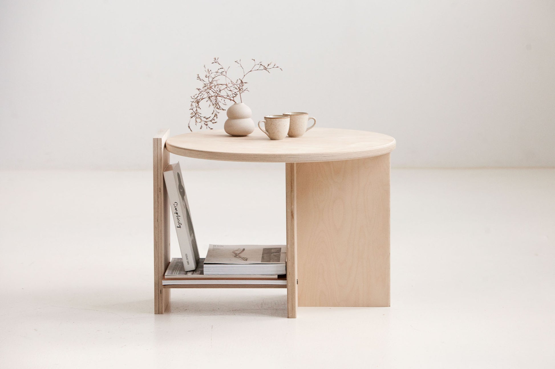 Round coffee table Europe available in walnut, teak, and natural birch finishes